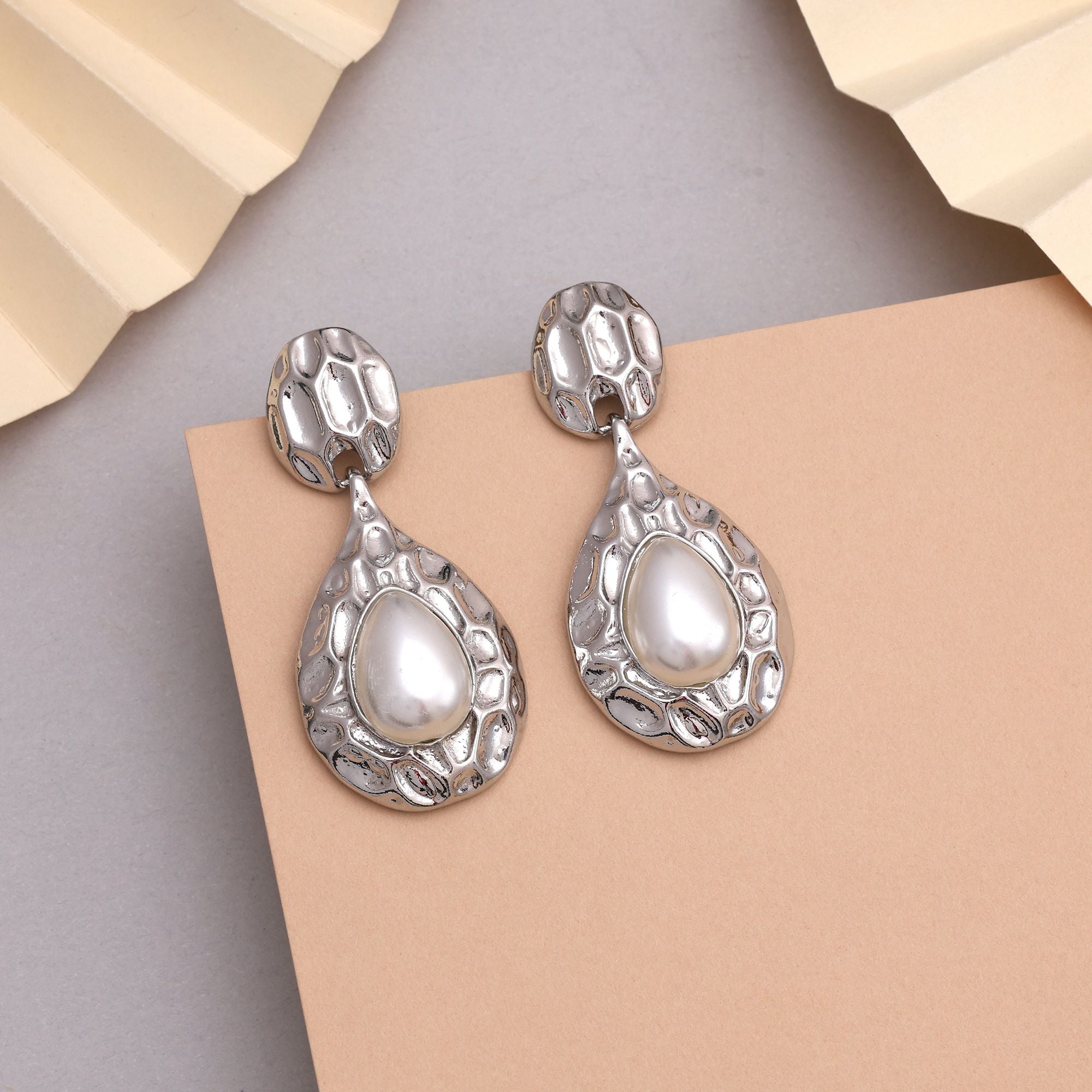 Beautiful White Color Anti Tarnish Earrings With Stone Studded Look For Festive Events
